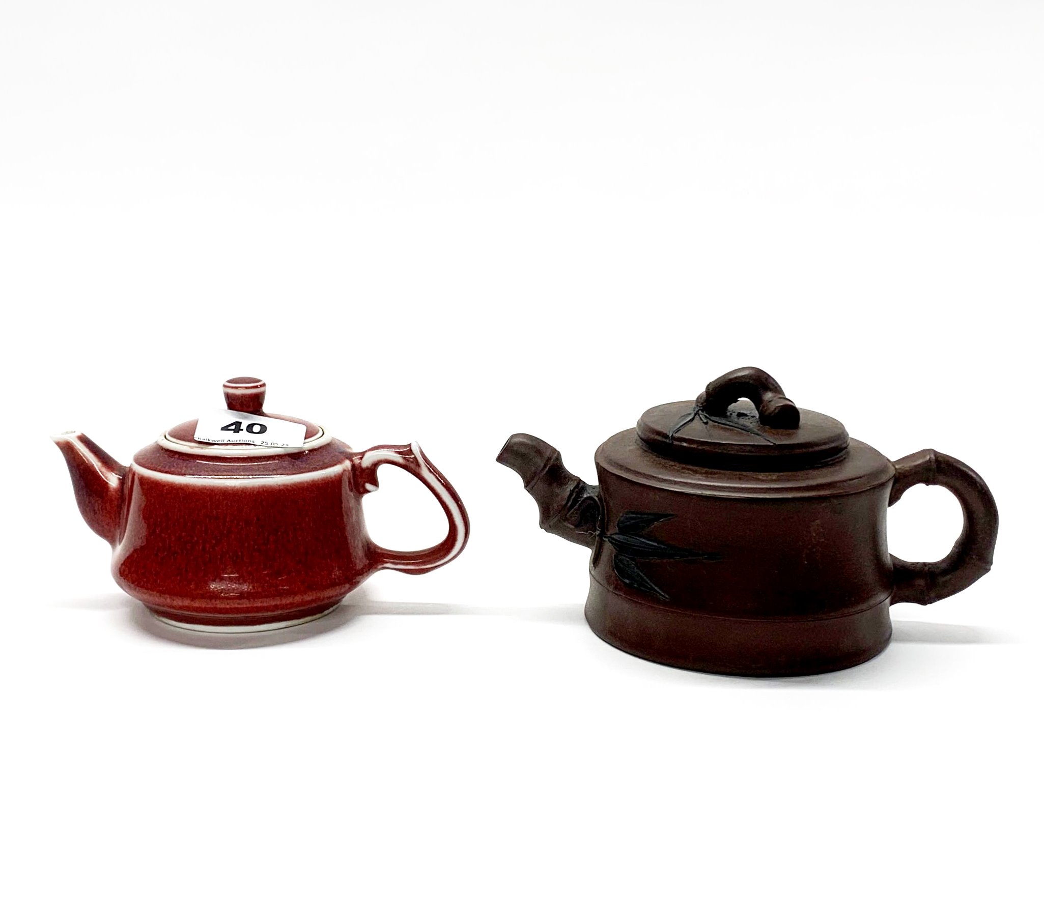 A Chinese Yi Xing terracotta teapot, H. 9cm, spout to handle 14cm, together with a sang de beouf