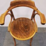 A vintage bentwood chair with impressed decoration to seat, H. 83cm.