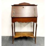 An Art Nouveau oak ladies bureau, W. 70cm, H. 115cm.