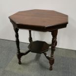 An octagonal mahogany two tier side table, H. 69cm W. 73cm together with a mahogany storage seat/