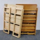 A group of three wooden folding shelves, folded 107 x 70cm.