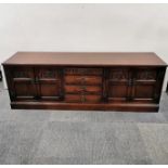 A oak sideboard by Old Charm Furniture, 183 x 48 x 62cm.