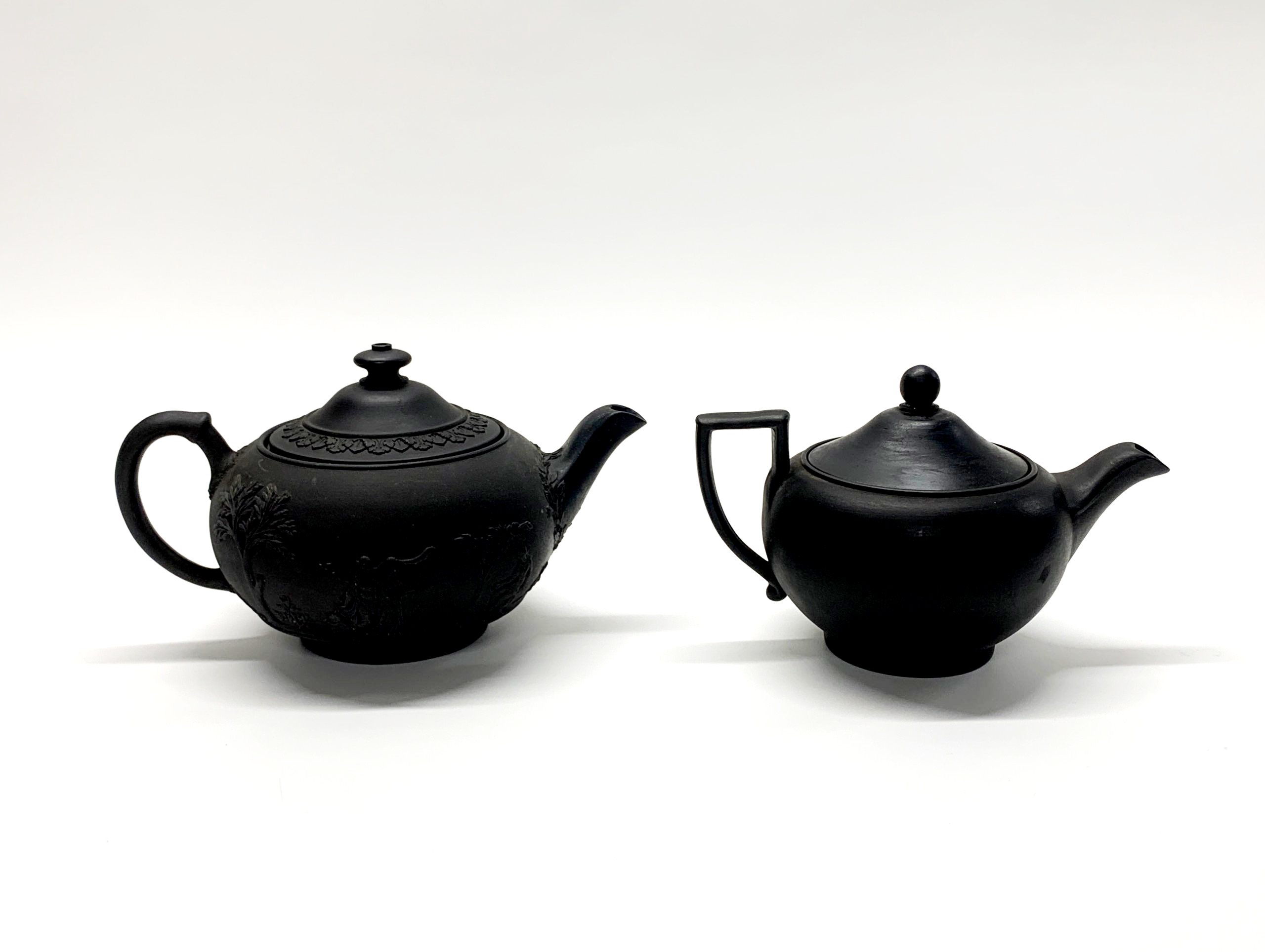 Two Wedgwood Black Basalt teapots, c. 1900, together with two Black Basalt dishes. - Image 2 of 5
