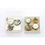 A group of seven old mechanical watch movements of various makes.