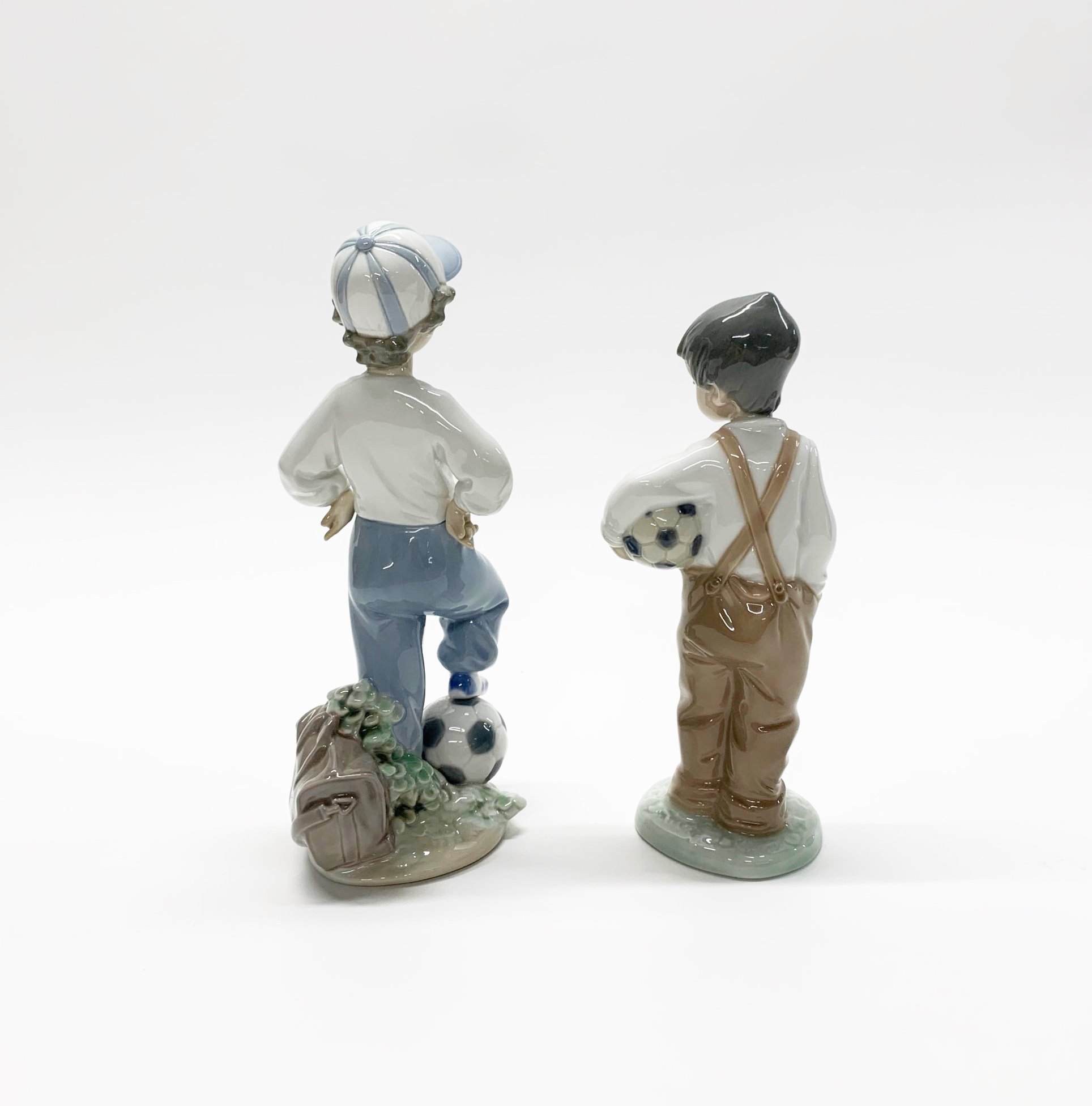 A Lladro figure of a boy with a football H. 21cm, together with a similar Nao figure. (with boxes). - Image 2 of 3