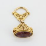 An antique 14ct yellow gold (marked 14K) fob set with a large oval cut amethyst, fob L. 5cm.