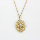 A large hallmarked 18ct yellow gold pendant set with brilliant cut diamonds, L. 3cm, on a hallmarked