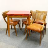 A 1960's Formica topped extending kitchen table with four Ben chairs.