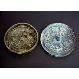 Two Chinese bronze hand mirrors, largest Dia. 13cm. Collector's reference numbers visible.