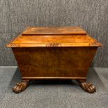 A late 18th/early 19th century walnut and walnut veneered cellarette with lion paws feet, 75 x 52