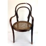 A child's antique bentwood chair.