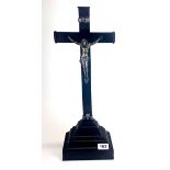 A 19th century white metal (tested silver) and ebony crucifix, H. 52cm.