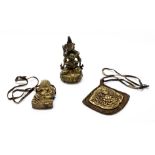 A group of three Tibetan Buddhist devotional items, figure H. 13cm.