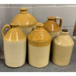 A group of stoneware jars and vintage glassware.