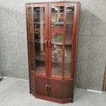 A mahogany veneered display cabinet.