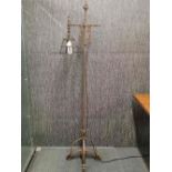 An Arts and Crafts wrought iron standard lamp, H. 168cm.