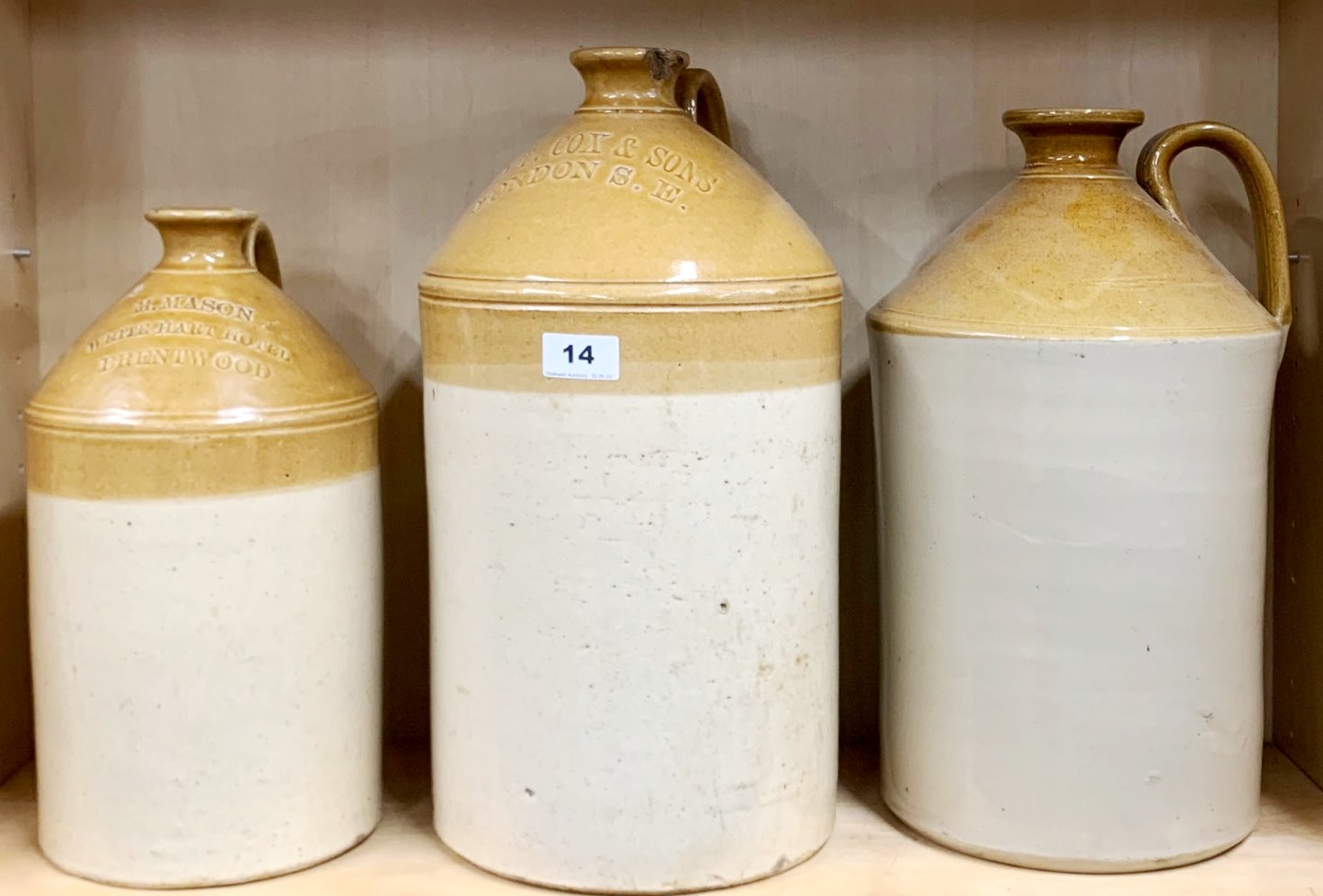 Three large stoneware jars, including The White Hart Hotel, Brentwood, H. 43cm.