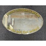 A Mann Crossman Beers advertising mirror, W. 70cm.