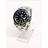 A Rolex GMT Master II (Batman) stainless steel chronometer wristwatch, recently serviced and in full