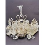 A group of four silver plated cruet sets, with two useful decanter stoppers, tallest 36cm.