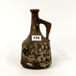 An unusual Troika style wine jug, H. 24cm.