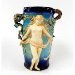 A 19th century Majolica vase with naturalistic handles and relief figures, understood to be