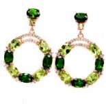 A pair of rose gold on 925 silver drop earrings set with oval cut peridots and chrome diopsides,