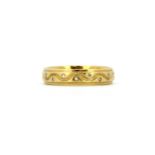 A 9ct yellow gold diamond set eternity ring, (N.5).