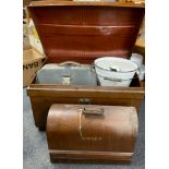 A vintage tin trunk, together with an enamelled bucket, sewing machine and other items.