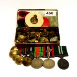 A tin of mixed medals, badges etc.