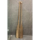 A pair of old wooden canoe oars, L. 152cm.