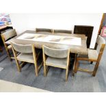 A 1970's signed tile topped extending oak dining table and six chairs, L. 162cm (closed) x 90cm.