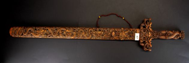 An interesting Chinese sword with wooden blade, L. 98cm.