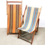 Two vintage folding deckchairs.