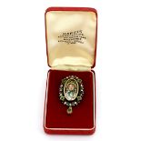 A large antique 18ct yellow and white gold enamelled portrait Pendant/brooch surrounded by rose