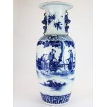 A large Chinese hand painted porcelain vase with liondog handles, H. 59cm.