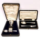 A cased hallmarked silver christening set, together with a cased hallmarked silver spoon and fork.