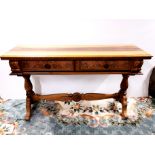 A South African carved stinkwood two drawer side table 153 x 85cm.