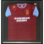 A framed, signed 7th March 1994 Bobby Moore memorial match West Ham shirt, frame size 83 x 95cm.