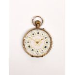 A ladies' antique 9 carat gold and enamel face fob watch, appears to be in working order.