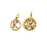 Two yellow metal (tested minimum 9ct gold) pendants of the letter 'K', largest 2 x 1.2cm.