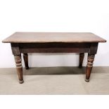 A 19th century mahogany low table with turned legs 125 x 53 x 65cm.