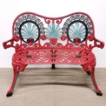 A painted cast metal garden seat, W. 101cm.