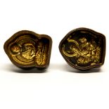 Two Tibetan bronze temple clay tablet moulds of the Buddha and another deity, H. 6cm.