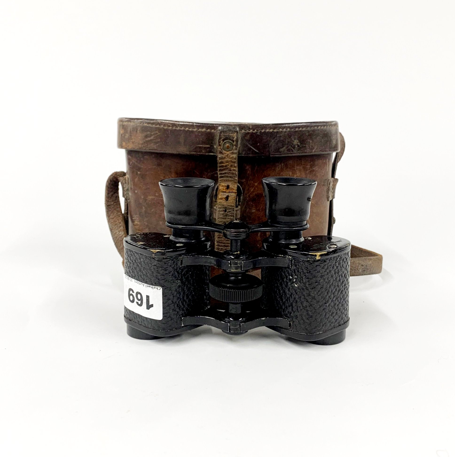 A pair of leather cased military issue binoculars.