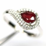 A matching 925 silver ring set with pear cut ruby and white stones, (N.5).