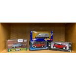 A boxed Corgi Classics Austen Healey, together with two further die cast models and a Corgi Classics