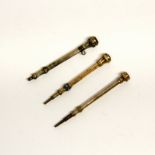 Three antique propelling pencils, each set with semi precious stones, L. 5cm.