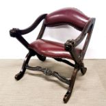 An unusual carved oak upholstered armchair.