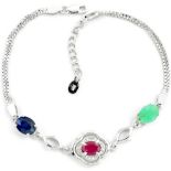 A 925 silver bracelet set with oval cut ruby, sapphire and emeralds, L. 18cm.